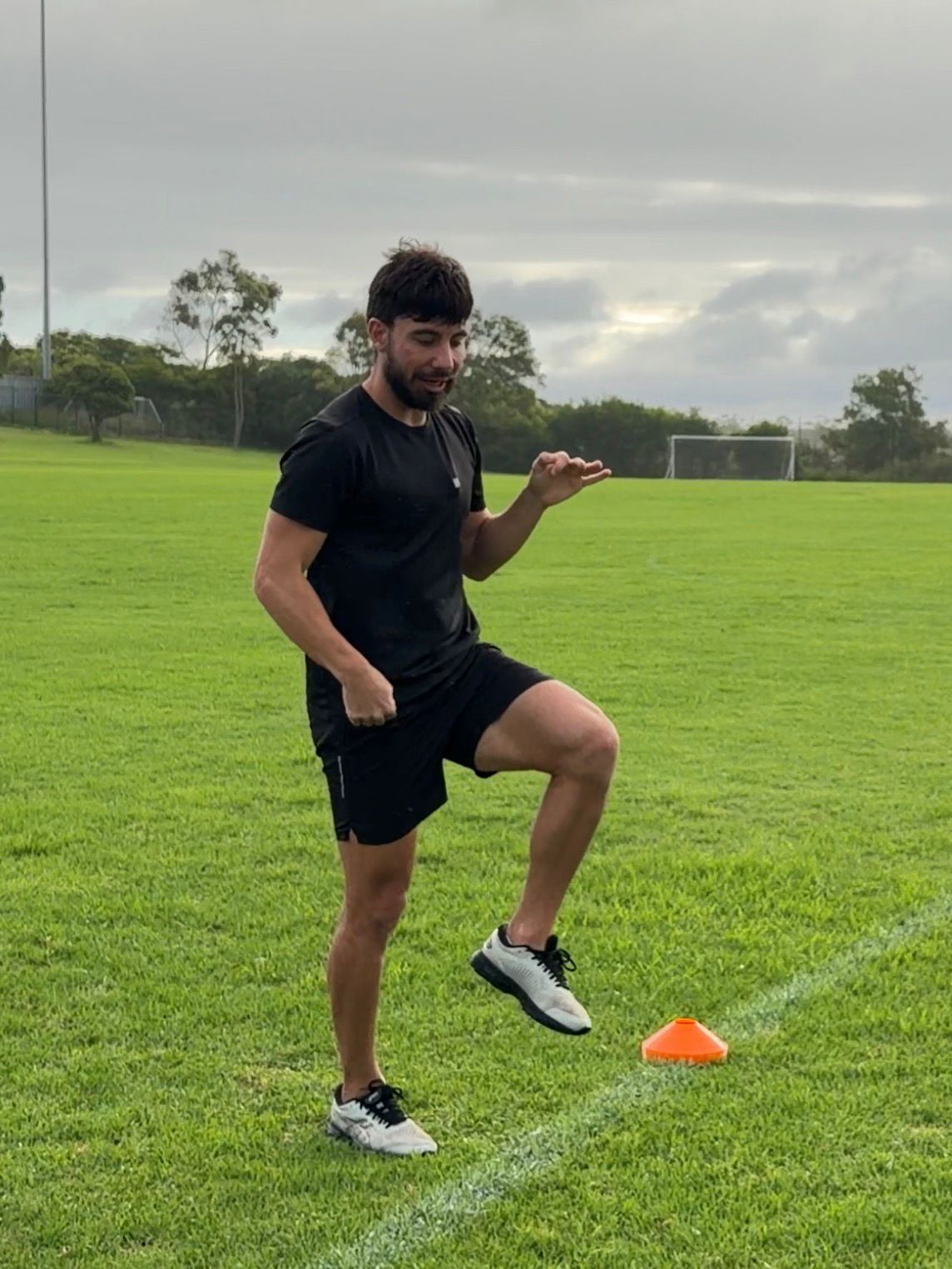 Anthony Atanasov coaching on field